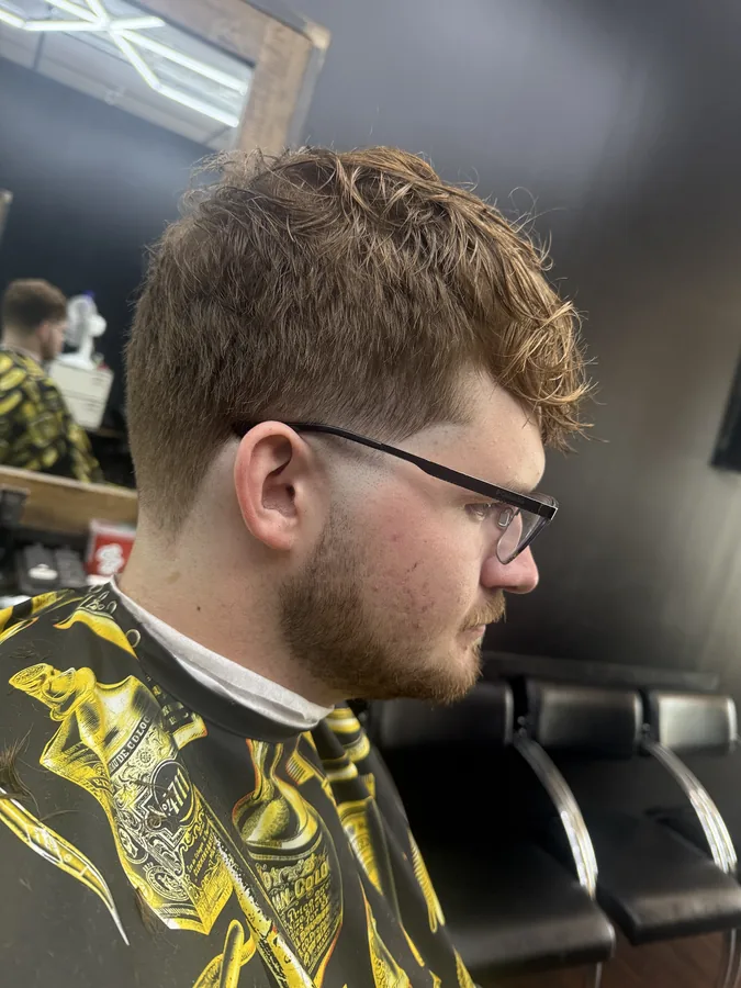 After photo of the same client with the curls shaped and the sides tapered