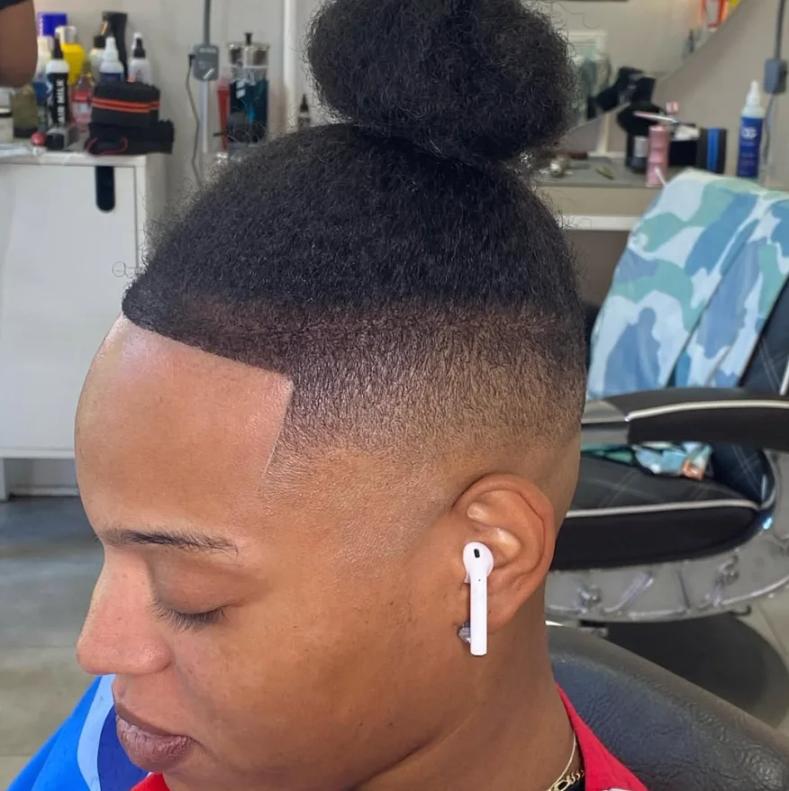 Finished high fade with a natural top pulled up
